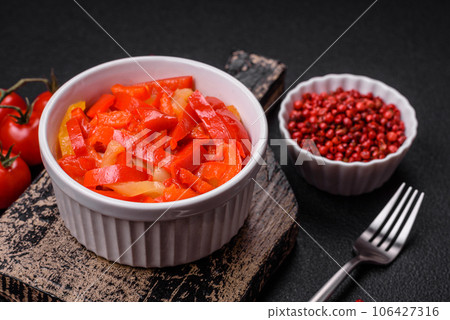 Delicious fresh saute sweet bell pepper slices with onion, salt, spices and herbs 106427316