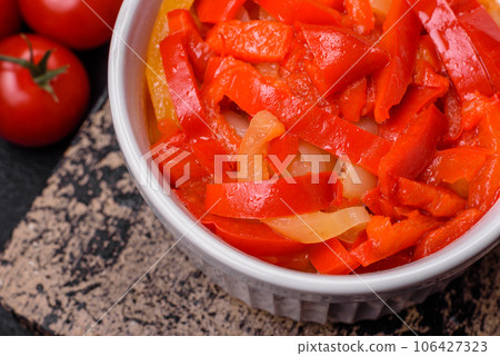 Delicious fresh saute sweet bell pepper slices with onion, salt, spices and herbs 106427323