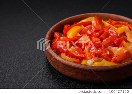 Delicious fresh saute sweet bell pepper slices with onion, salt, spices and herbs 106427330