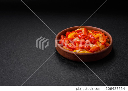 Delicious fresh saute sweet bell pepper slices with onion, salt, spices and herbs 106427334
