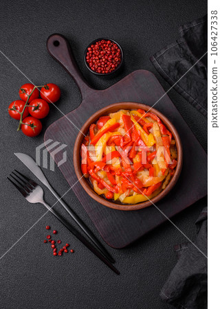 Delicious fresh saute sweet bell pepper slices with onion, salt, spices and herbs 106427338