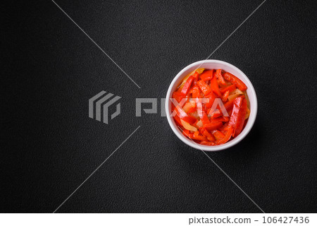 Delicious fresh saute sweet bell pepper slices with onion, salt, spices and herbs 106427436