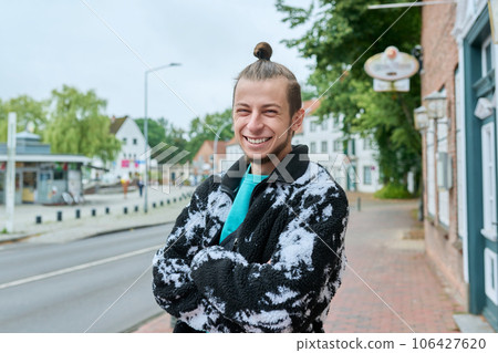 Portrait of laughing cheerful hipster guy outdoor, on city street Portrait of laughing cheerful hipster guy outdoor, on city street 106427620