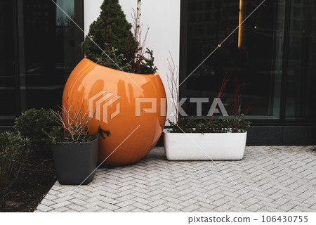 City landscape, Orange flower pot on a front of the residential building in Down Town of New Jersey City landscape, Orange flower pot on a front of the residential building in Down Town of New Jersey 106430755