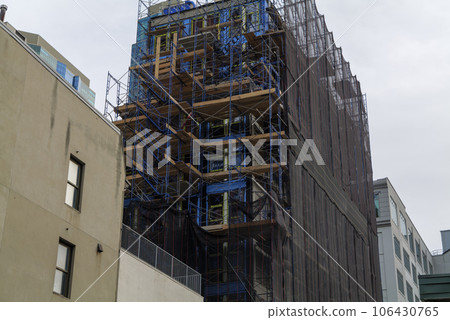 construction site building under construction: concrete and wood structure and scaffolds. construction site building under construction: concrete and wood structure and scaffolds. 106430765