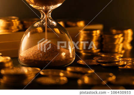 Hourglass and money Time is money 106430933