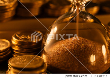 Hourglass and money Time is money Hourglass and money Time is money 106430934