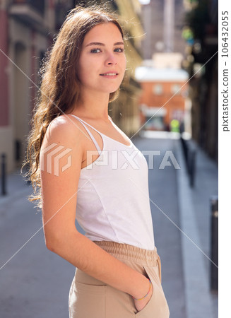 Cheerful attractive female walking on street outdoor 106432055