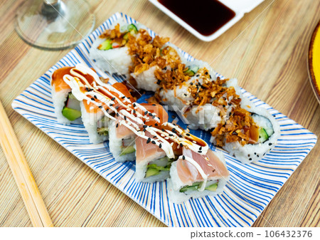 Uramaki Dragon and Karikari roll - beautifully served delicious food japanese. Uramaki Dragon and Karikari roll - beautifully served delicious food japanese. 106432376