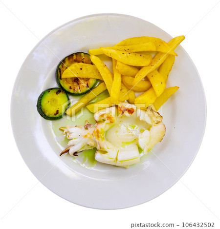 Cuttlefish with garlic and parsley served with potatoes and zucchini 106432502