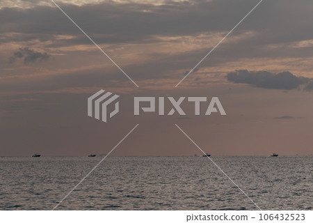 Beautiful sunset on the beach and sea - Vintage Filter 106432523
