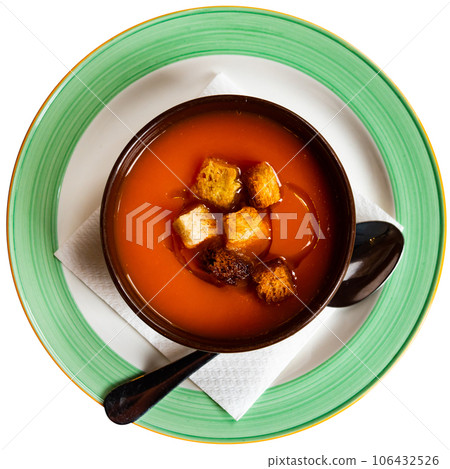 Creamy carrot soup garnished with crispy toasted bread 106432526