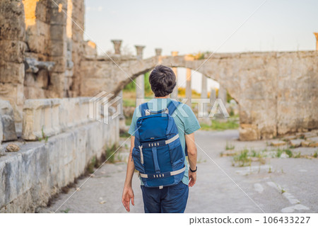 Tourist man at the ruins of ancient city of Perge near Antalya Turkey 106433227