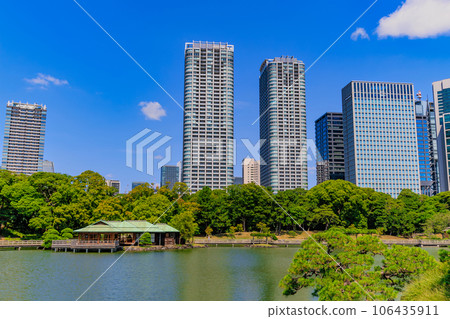Hamarikyu Gardens, Chuo-ku, Tokyo, tidal pond and skyscrapers 106435911