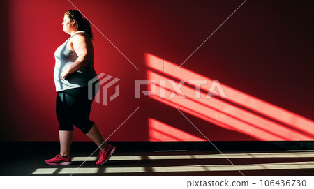 Obese woman / Overweight woman exercising at the gym Obese woman / Overweight woman exercising at the gym 106436730