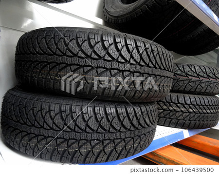 New all weather tires shows on the showcase of tire shop  106439500