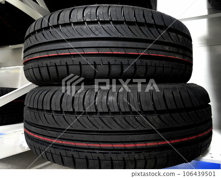 New summer tires on the showcase of tire shop 106439501