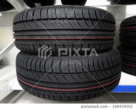 New modern car tires on the showcase of tire store 106439502