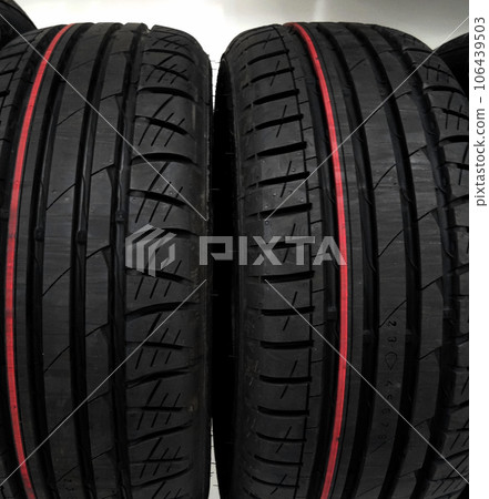Car tires stacked on a shelf at car parts shop Car tires stacked on a shelf at car parts shop 106439503