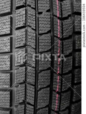 Pattern and blocks design of new vehicle tire closeup 106439504