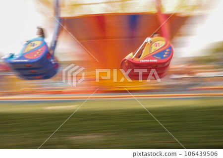 Kids playing in the amusement park 106439506
