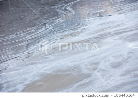 Muddy waters in a decanting pond. Toxic residuals from a copper mine decanting in a settling basin 106440164