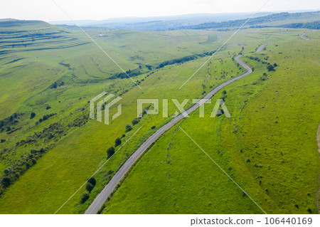 Above view of countryside road, aerial view 106440169