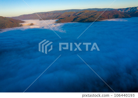 Aerial view of morning fog in the valley in dawn 106440193