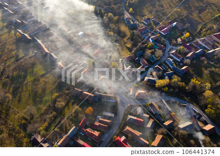 Aerial view of morning haze over a village 106441374