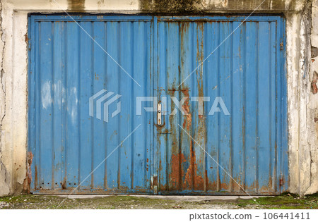 Grunge metallic blue garage door Grunge metallic blue garage door 106441411