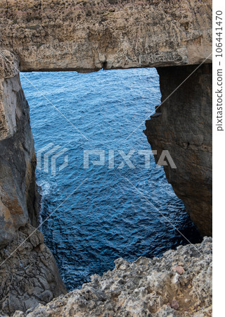 Wied il Mielah canyon, natural arch over the sea. Gozo, Malta Wied il Mielah canyon, natural arch over the sea. Gozo, Malta 106441470