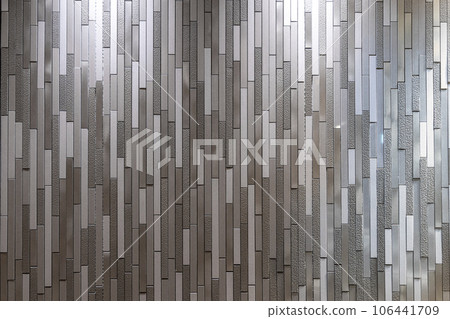 metal mosaic wall reflecting light 106441709