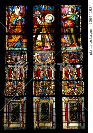 Stained glass window detail with Biblical scene 106441924