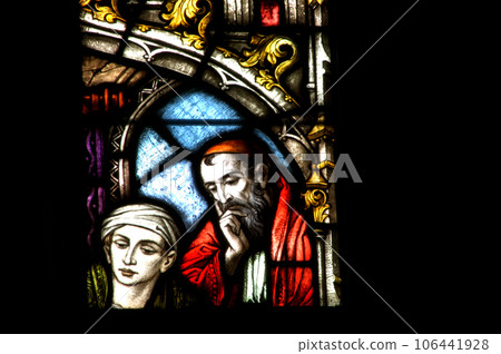 Stained glass window detail with Biblical scene 106441928