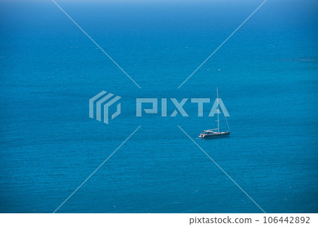 Alone yacht sailing in open sea Alone yacht sailing in open sea 106442892