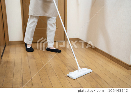 Women's feet with flooring wipers 106445342