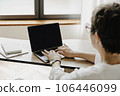 Back view of senior business woman using laptop. 106446099