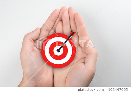 Setting goals, strategy, success concept. Businessman holding target, business targeting, aiming, focus concept. Business achievement goal and objective target concept. 106447095