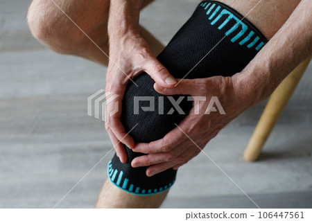 Knee brace support for fitness and sports injuries. Black and blue soft breathable material  106447561