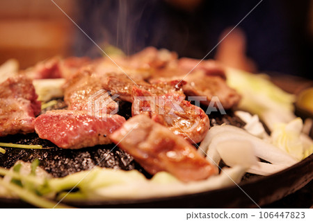 Bake raw lamb in a Genghis Khan pot 106447823