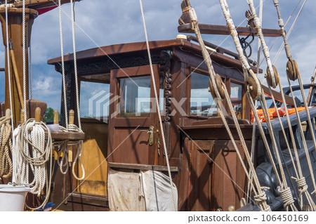fragment of the rigging of a wooden sailing ship close-up 106450169