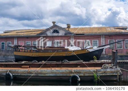 old wooden piers, a sailing ship is moored next to a floating jetty houseboat old wooden piers, a sailing ship is moored next to a floating jetty houseboat 106450170