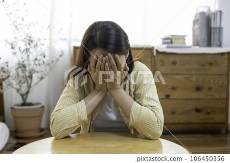 woman hand touching head have headache, young Asian female stressed from hard work, woman hand touching head have headache, young Asian female stressed from hard work, 106450356