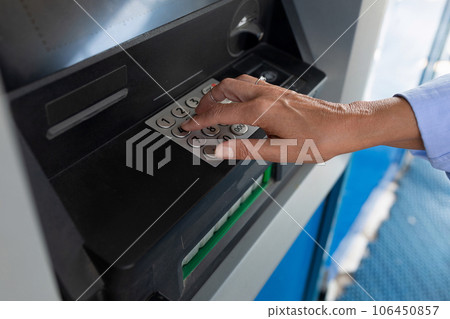 female hand enters pin code at ATM female hand enters pin code at ATM 106450857