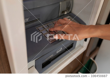 female hand enters pin code at ATM female hand enters pin code at ATM 106450887