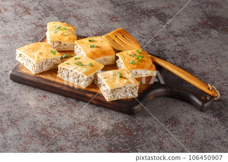 Sausage and Cheese Crescent Squares pie close-up on a board. Horizontal Sausage and Cheese Crescent Squares pie close-up on a board. Horizontal 106450907