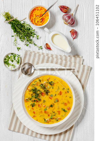Beer cheese soup with vegetables and thyme 106451102