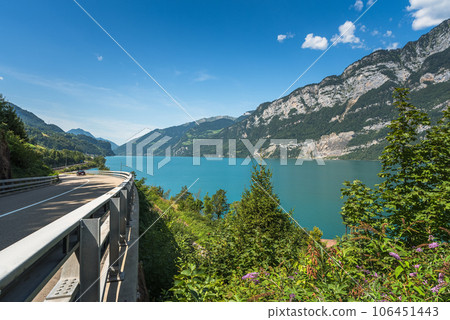 Panoramic view of Lake Walensee (Lake Walen) with scenic road, Canton St. Gallen, Switzerland Panoramic view of Lake Walensee (Lake Walen) with scenic road, Canton St. Gallen, Switzerland 106451443