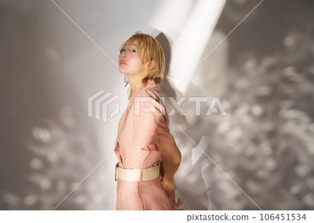 Fashion portrait image of a woman with light and shadow 106451534