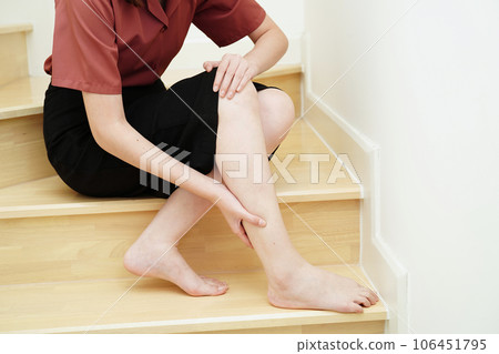 Asian lady woman injury from falling down on slippery surfaces stairs at home. Asian lady woman injury from falling down on slippery surfaces stairs at home. 106451795